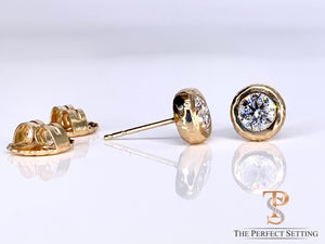 Lab diamonds bezel set rustic gold earrings.