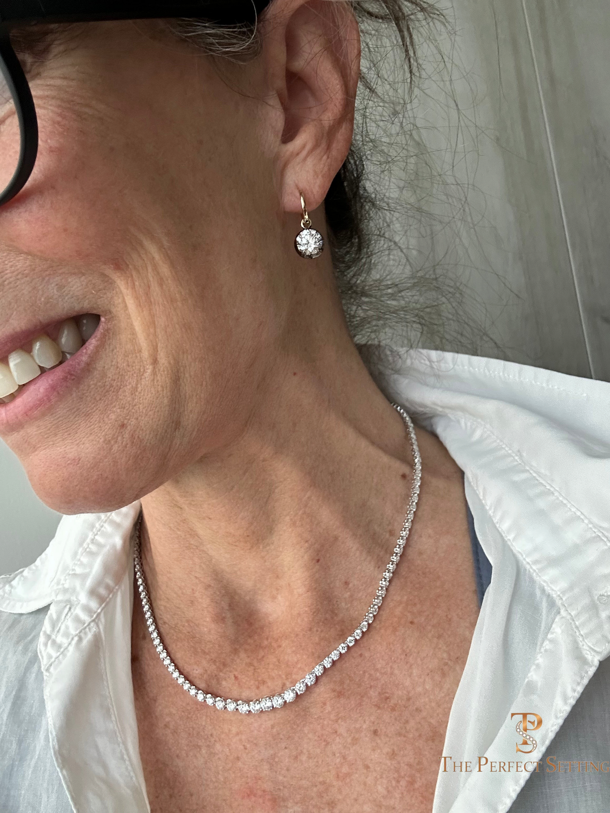 The Perfect Setting, Inc. 10.40 carat round diamond Riviera necklace in 14K white gold worn by a woman