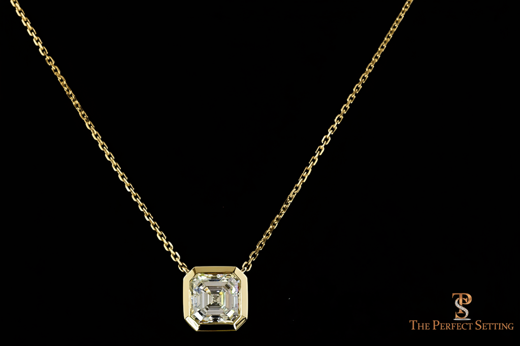 Asscher cut diamond bezel necklace in yellow gold