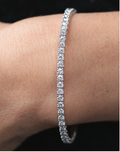 Lab Diamond flex bangle bracelet on a person's wrist 