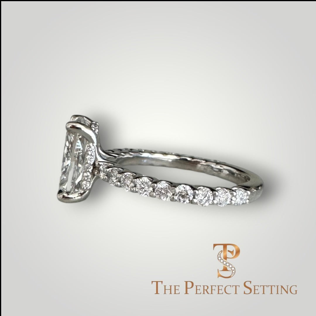 The Perfect Setting, Inc. platinum engagement ring with a 2.56 ct elongated cushion cut diamond and pavé hidden halo.