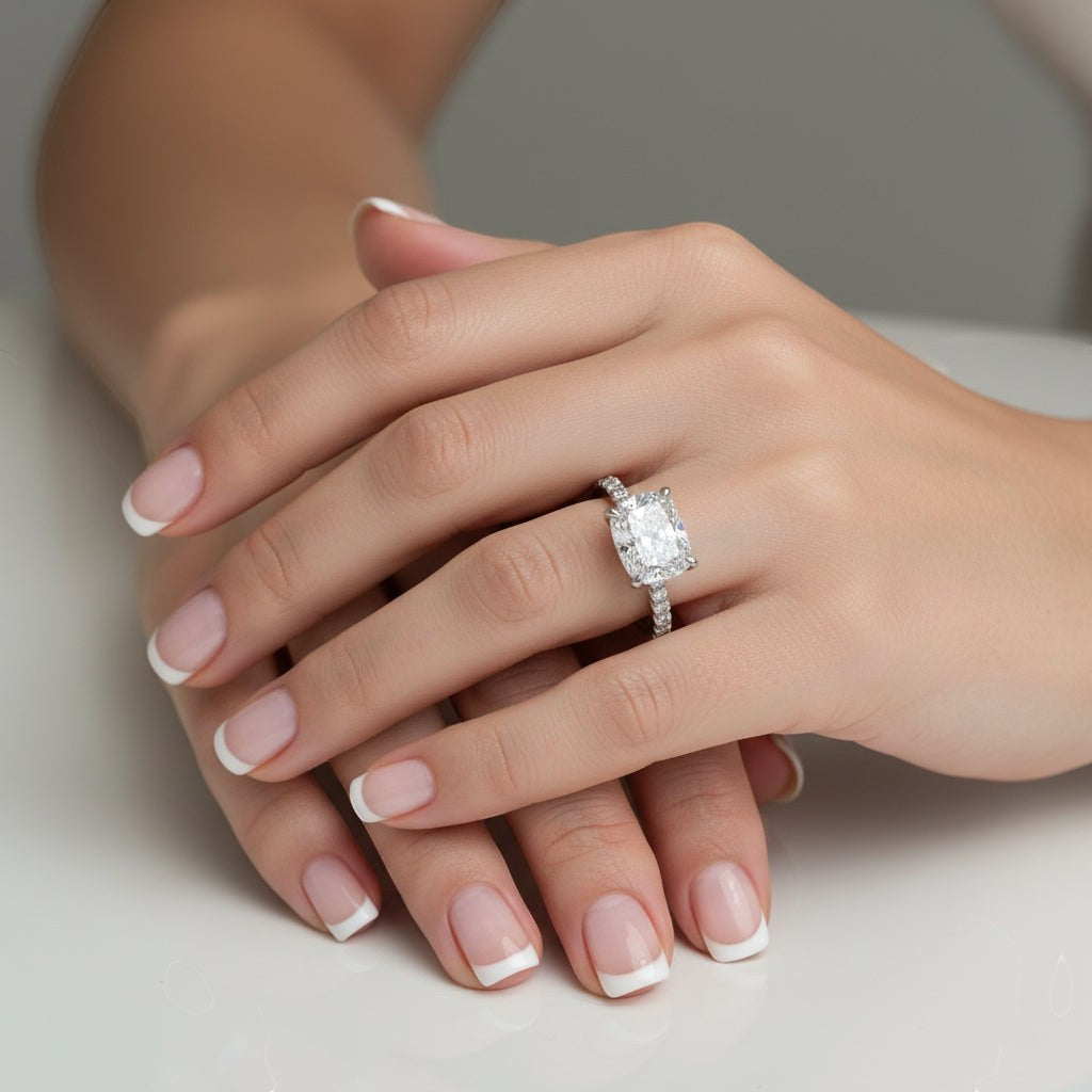 The Perfect Setting, Inc. platinum engagement ring with a 2.56 ct elongated cushion cut diamond and pavé hidden halo.
