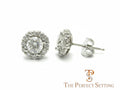 The Perfect Setting, Inc diamond halo stud earrings featuring a central round diamond surrounded by smaller stones.