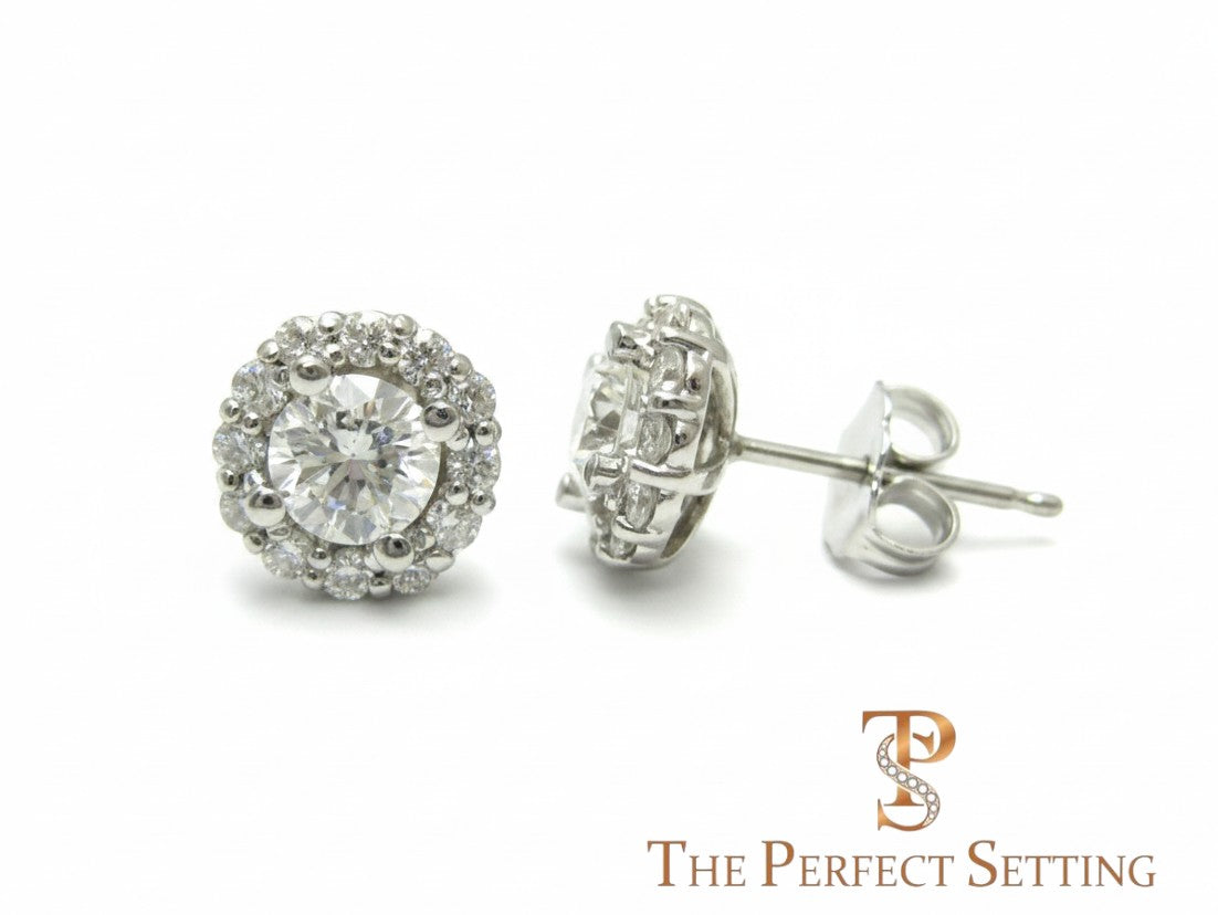 The Perfect Setting, Inc diamond halo stud earrings featuring a central round diamond surrounded by smaller stones.