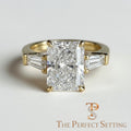 The Perfect Setting, Inc radiant cut diamond engagement ring with tapered baguette side stones in 18K yellow gold