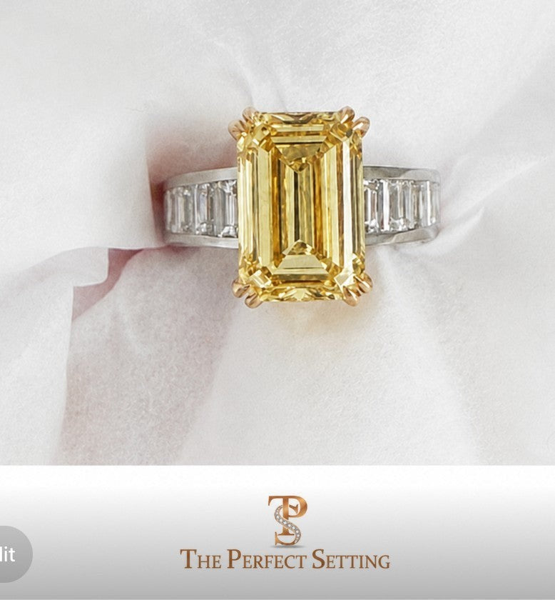 The Perfect Setting, Inc emerald cut vivid yellow diamond engagement ring with baguette side stones on white fabric