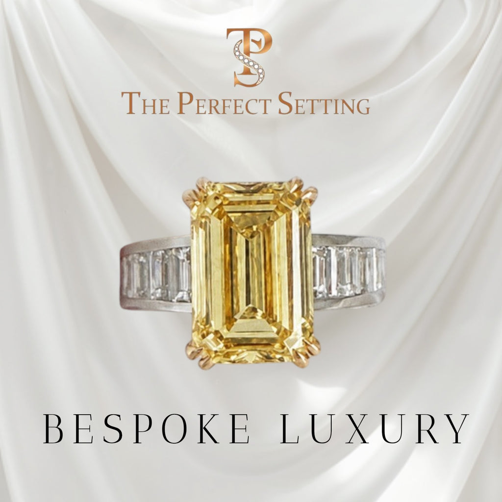 The Perfect Setting, Inc emerald cut vivid yellow diamond engagement ring with baguette side stones on marble pedestal