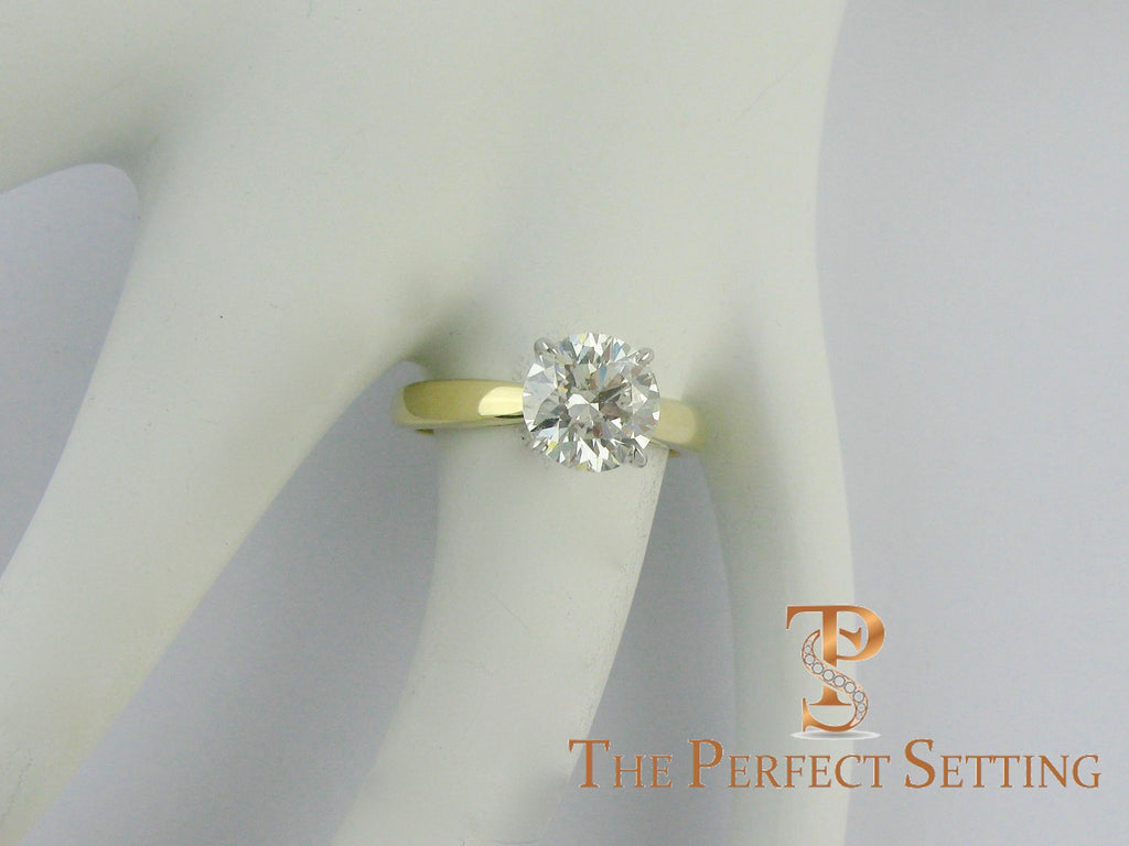 2 ct round diamond yellow gold platinum ring on finger