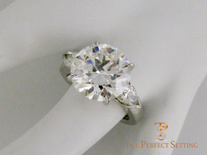 7 ct graft round diamond pear 3 stone engagement ring  finger