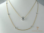 Diamonds bezel set on cable chain in 14K yellow gold