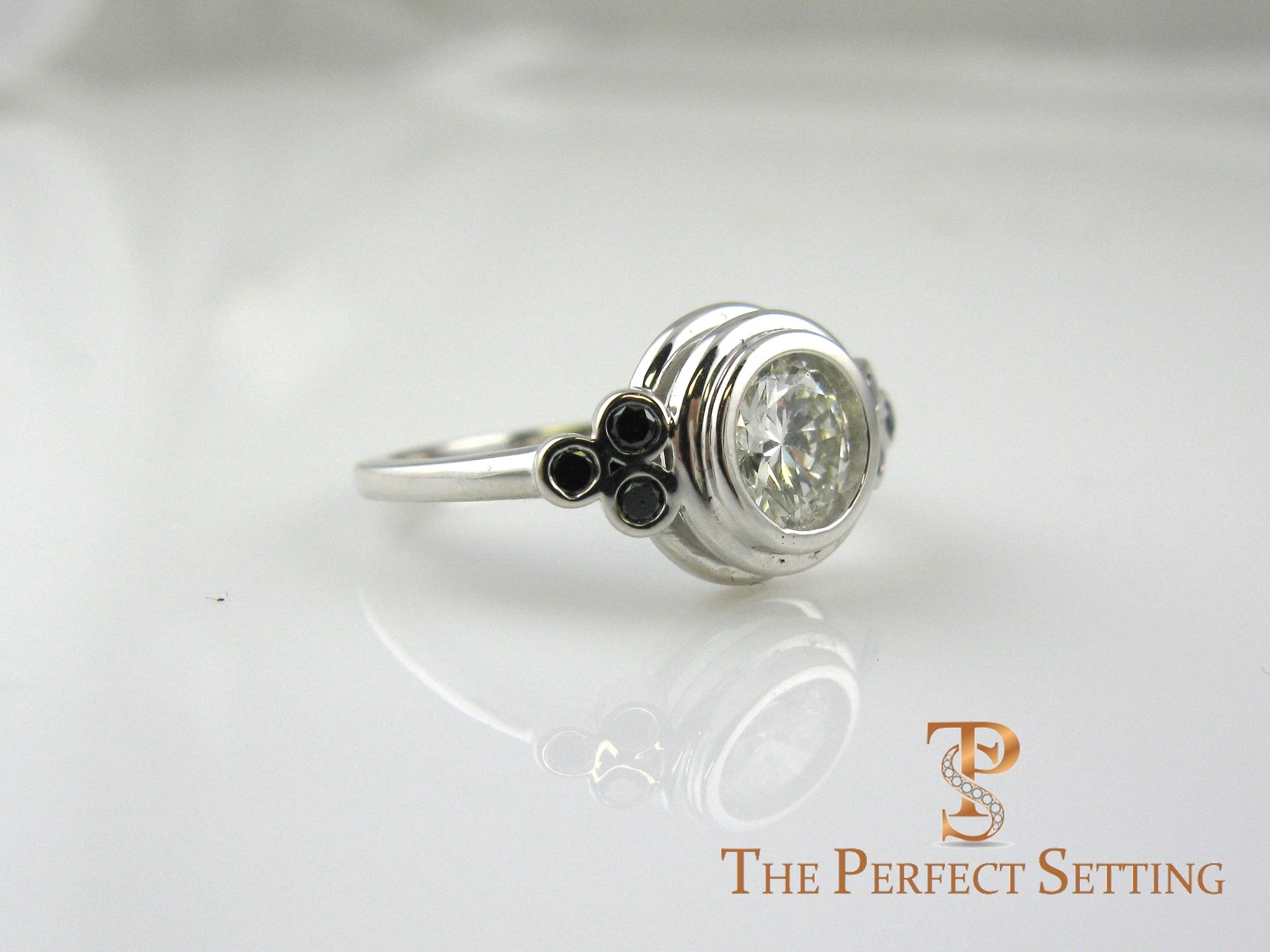 Bezel diamond ring with black diamond accents