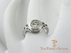 Bezel diamond ring with black diamond accents