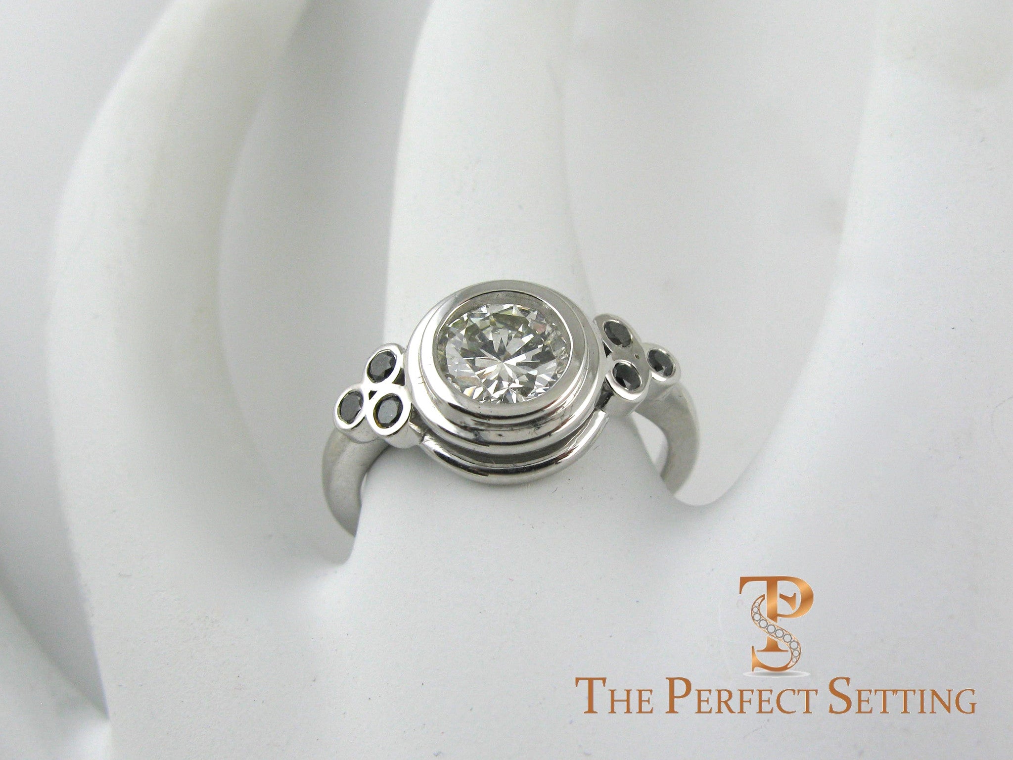 Bezel diamond ring with black diamond accents