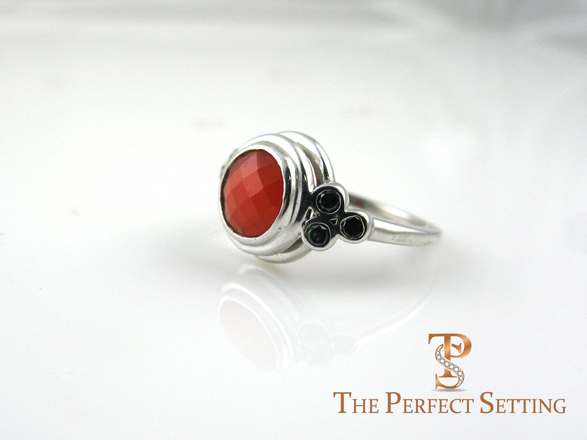 cornelian ring with black diamond accents