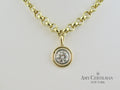 bezel set diamond white and yellow gold necklace 