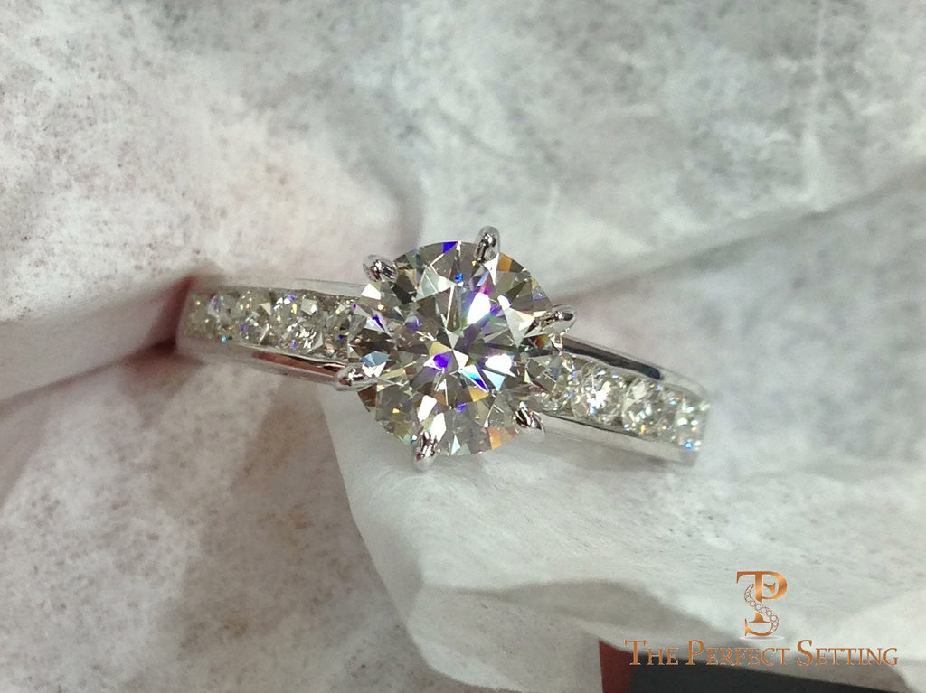 Diamond engagement ring channel setting