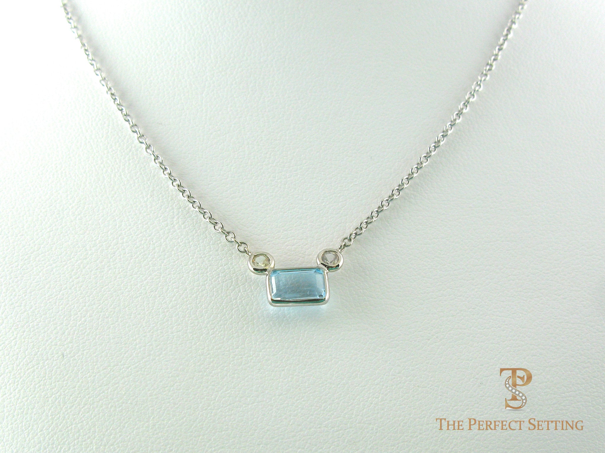Emerald Cut Aquamarine With Diamond Accents Pendant
