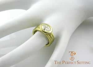 Oval Diamond 18K yellow gold bezel setting right hand ring