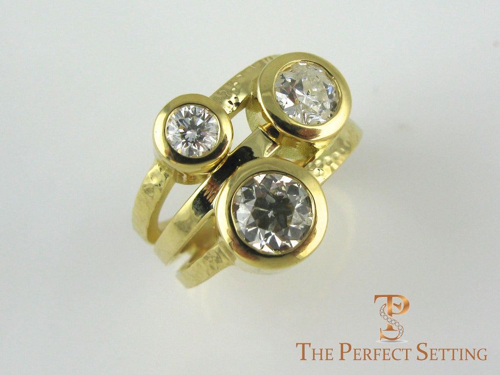 Three Stone Bezel ring in yellow gold