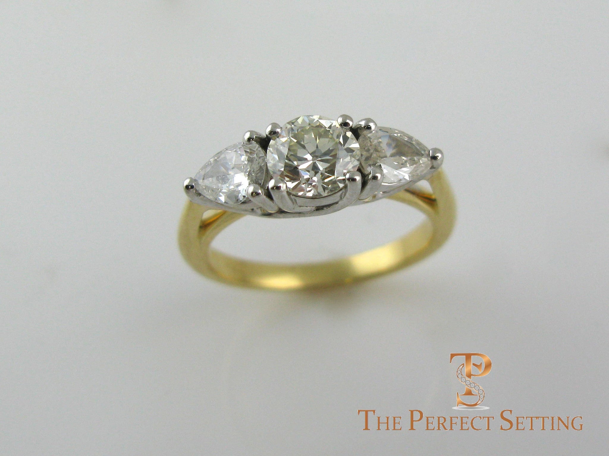Pear and Round Diamond Three Stone Engagement Ring