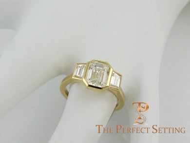 three stone emerald cut diamond custom bezel set ring