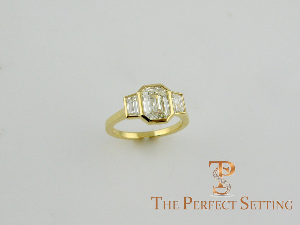 3 stone emerald cut diamond custom bezel set ring