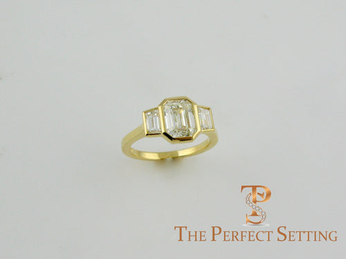 3 stone emerald cut diamond custom bezel set ring