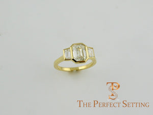 3 stone emerald cut diamond custom bezel set ring