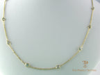 Diamonds bezel set on cable chain in 14K yellow gold