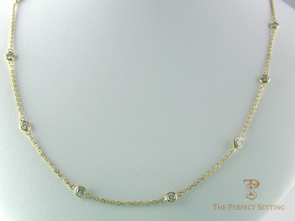 Diamonds bezel set on cable chain in 14K yellow gold