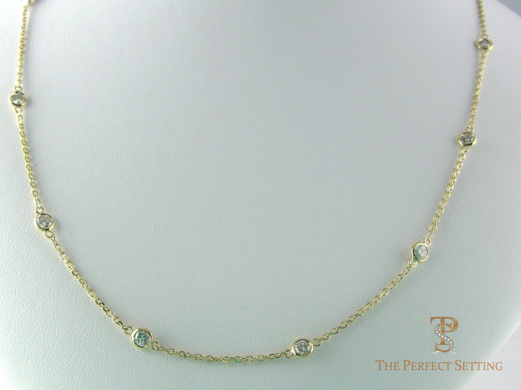 Diamonds bezel set on cable chain in 14K yellow gold