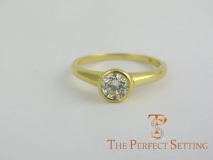 GIA certified round diamond bezel set ring 18K yellow gold