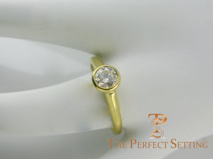 GIA certified round diamond bezel set ring