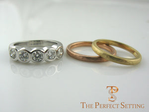 bezel set diamond ring with rose and yellow gold bands