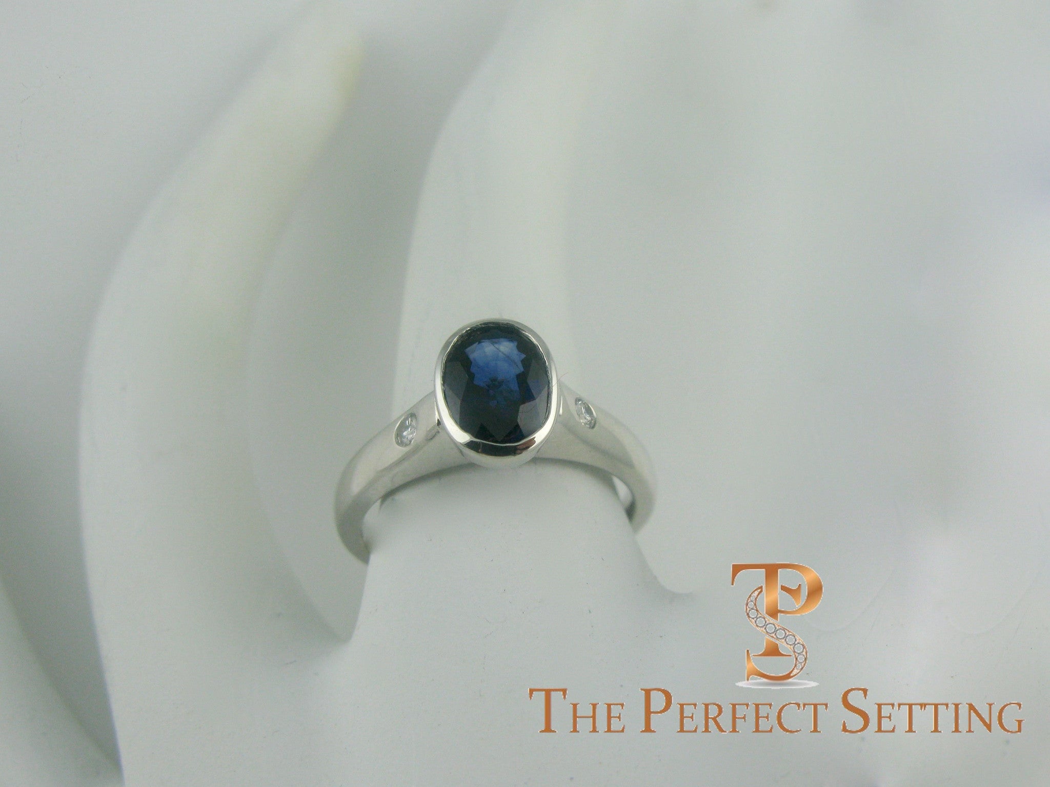 Bezel Set Oval Sapphire and Diamond Ring