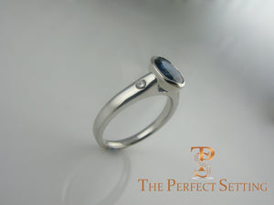 Bezel Set Oval Sapphire and Diamond Ring