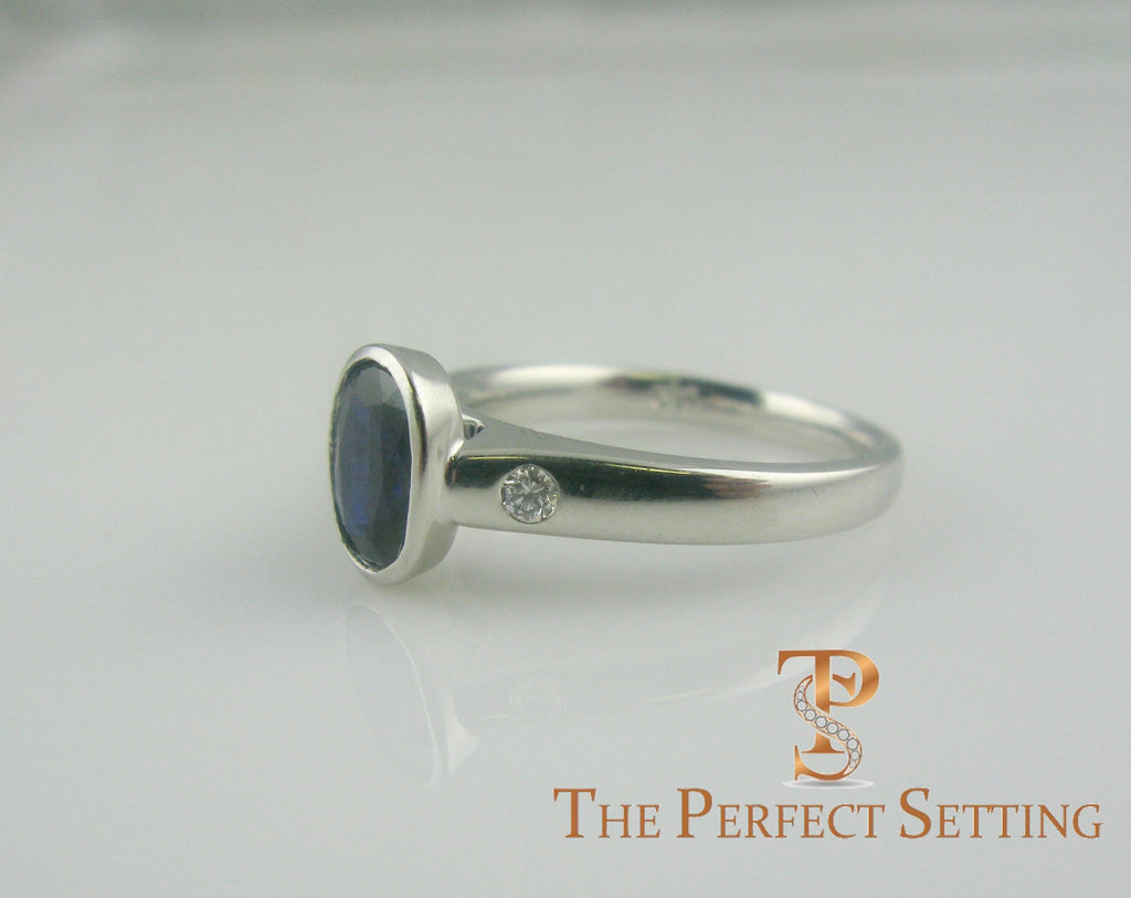 Bezel Set Oval Sapphire and Diamond Ring