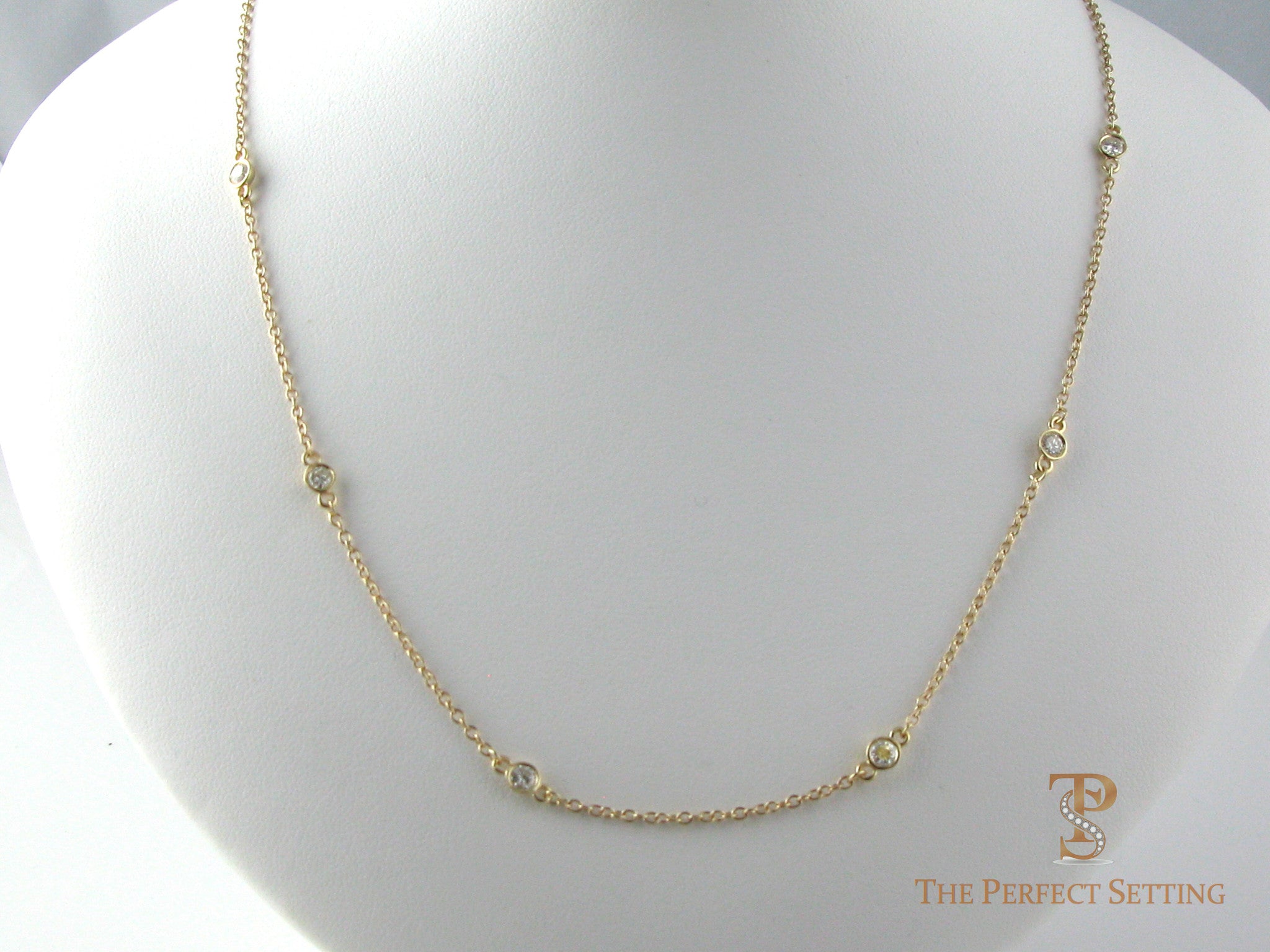 Diamonds bezel set on cable chain in 14K yellow gold