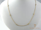 Diamonds bezel set on cable chain in 14K yellow gold